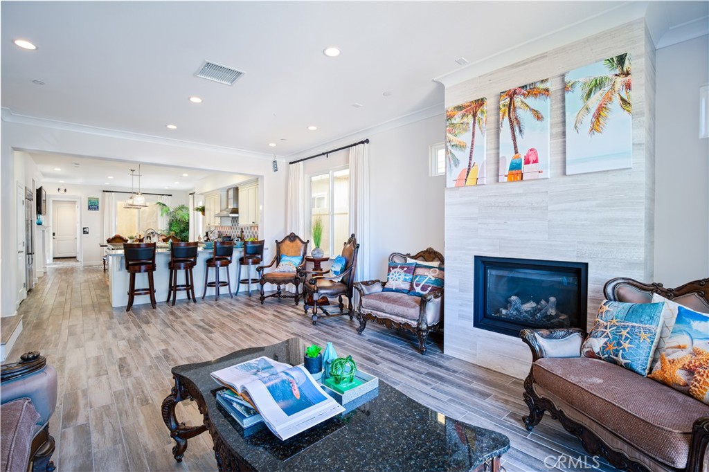 610 17th Street Huntington Beach, CA 92648 - Photo 6 of 64 a living room with furniture and a fireplace