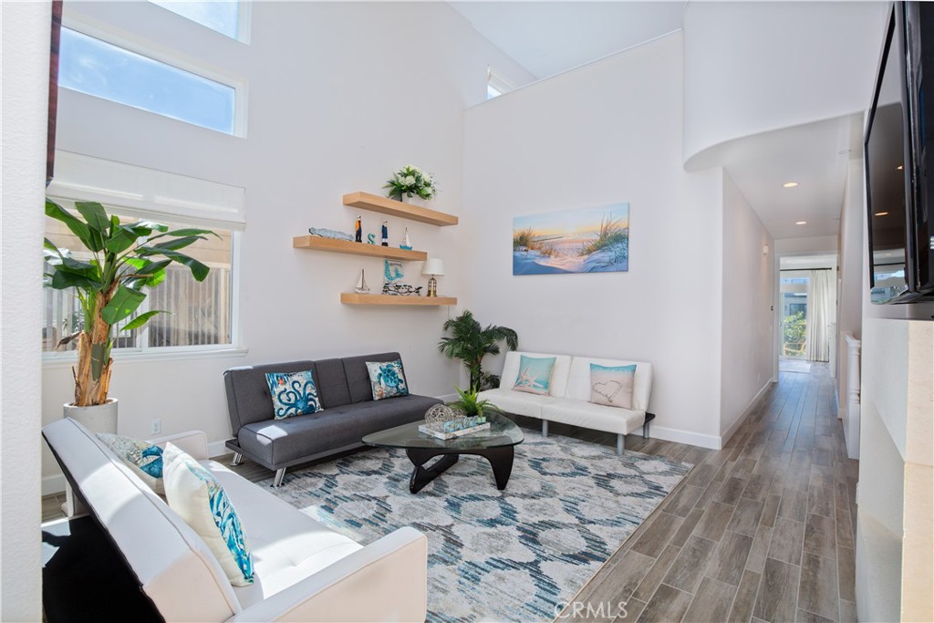 610 17th Street Huntington Beach, CA 92648 - Photo 10 of 64 a living room with furniture and a couch