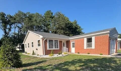 a view of a house with a yard