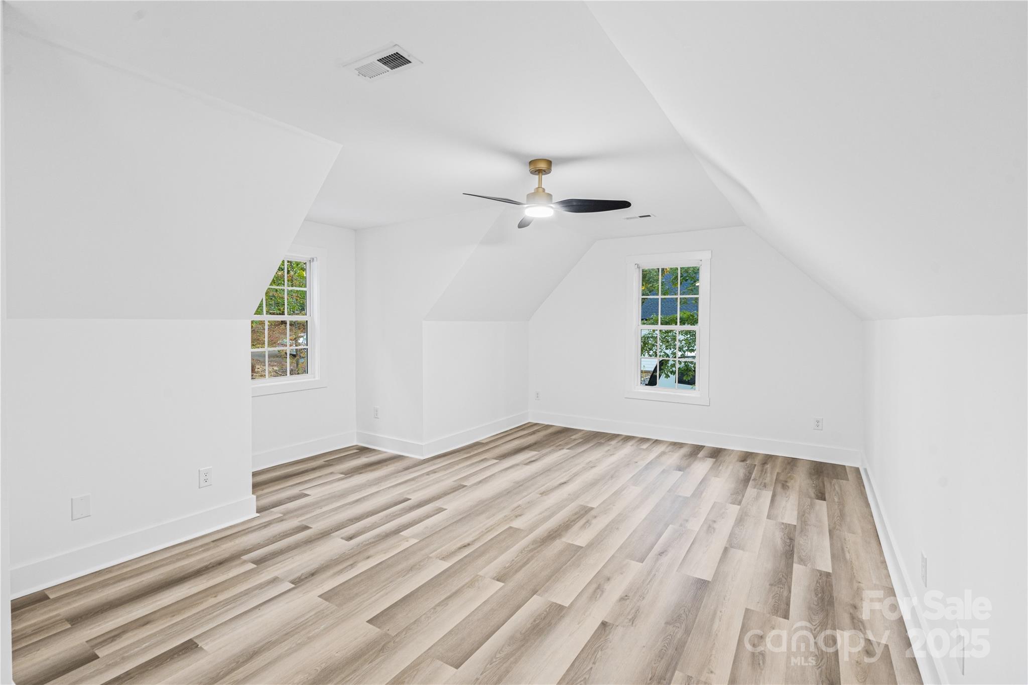2105 Timber Ridge Road Monroe, NC 28112 - Photo 19 of 27 an empty room with windows and ceiling fan