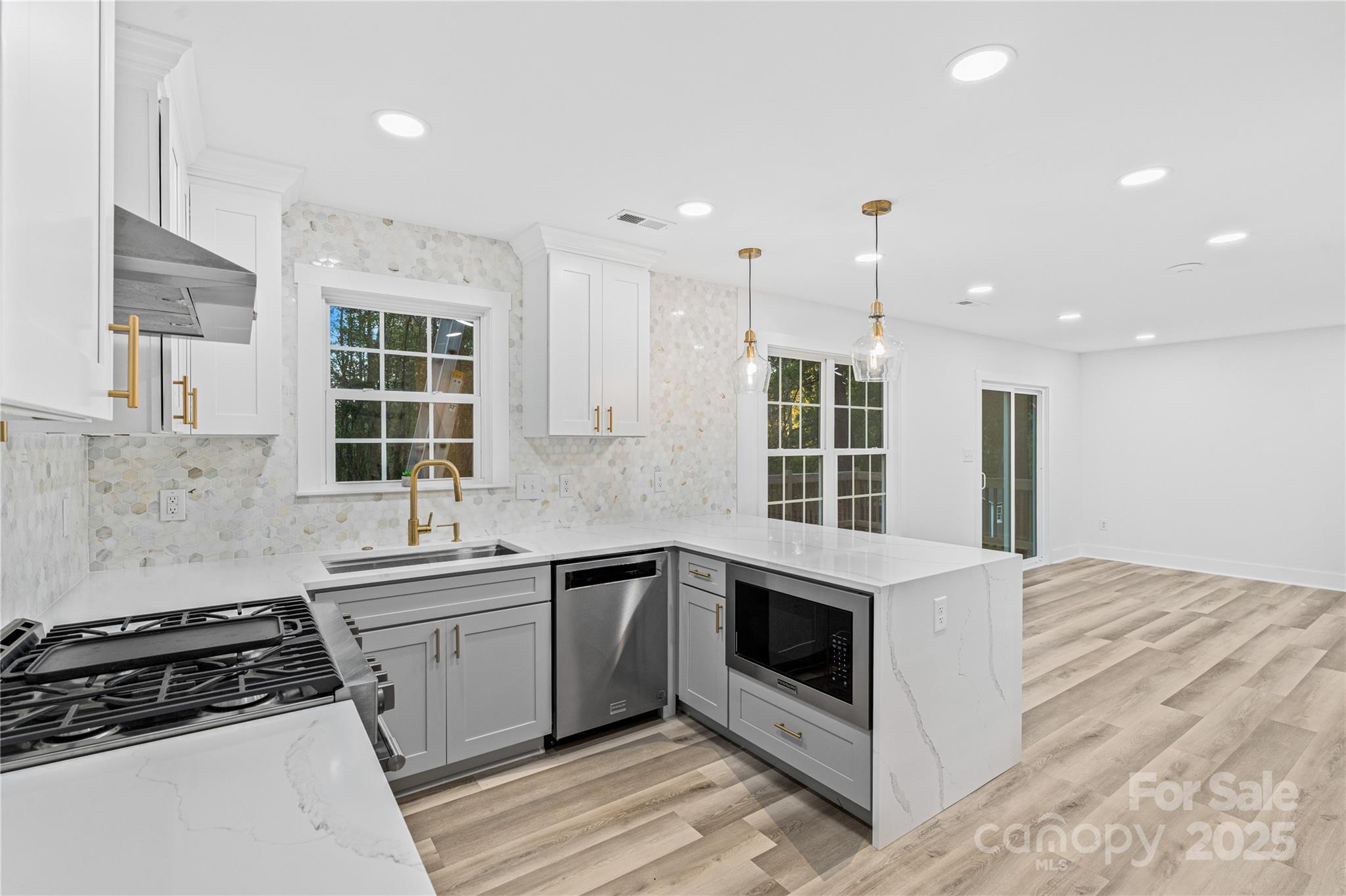 2105 Timber Ridge Road Monroe, NC 28112 - Photo 6 of 27 a kitchen that has a sink and a stove in it