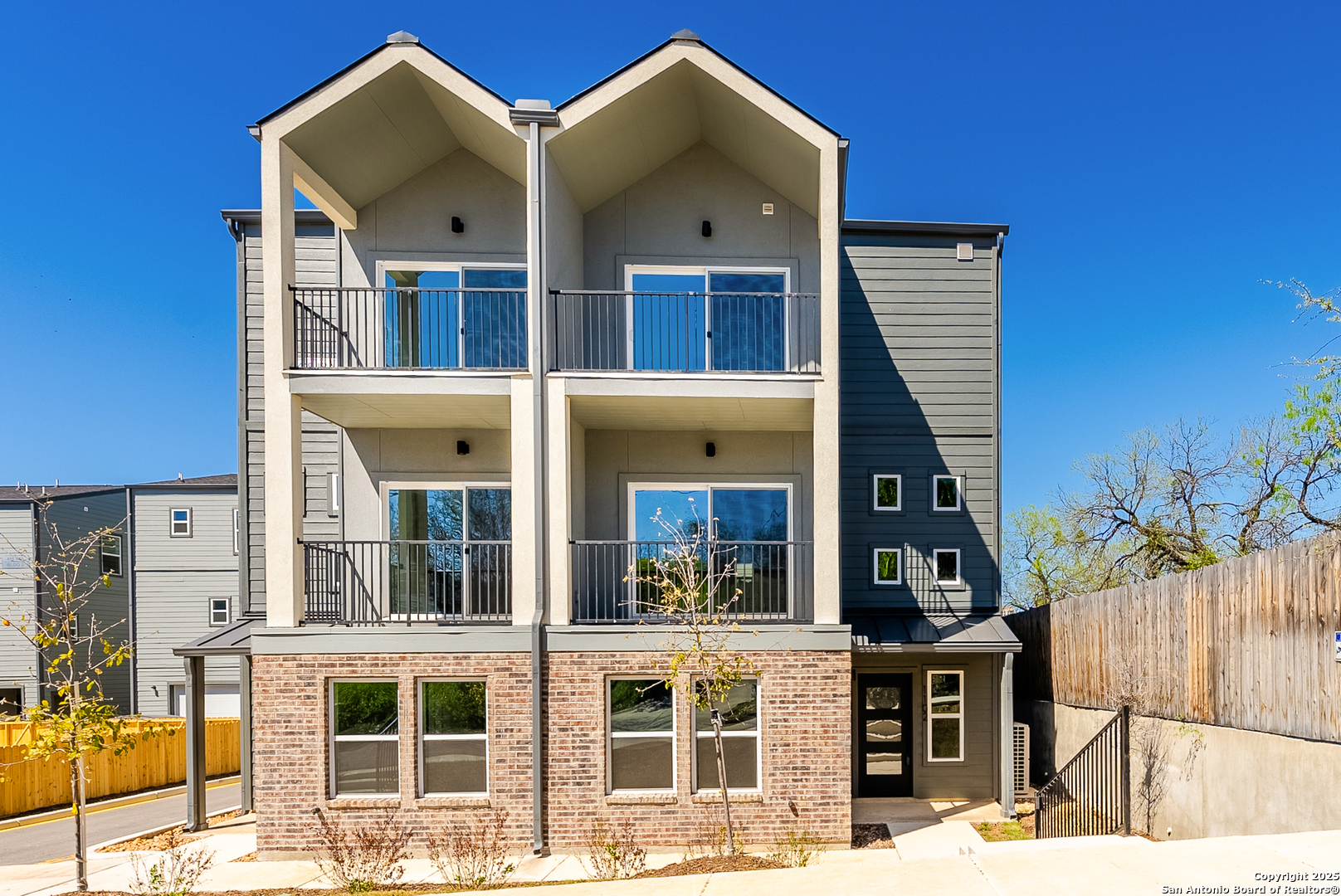 419 Ira Avenue, Unit 1101 San Antonio, TX 78209 - Photo 1 of 22 a view of a white building among the street