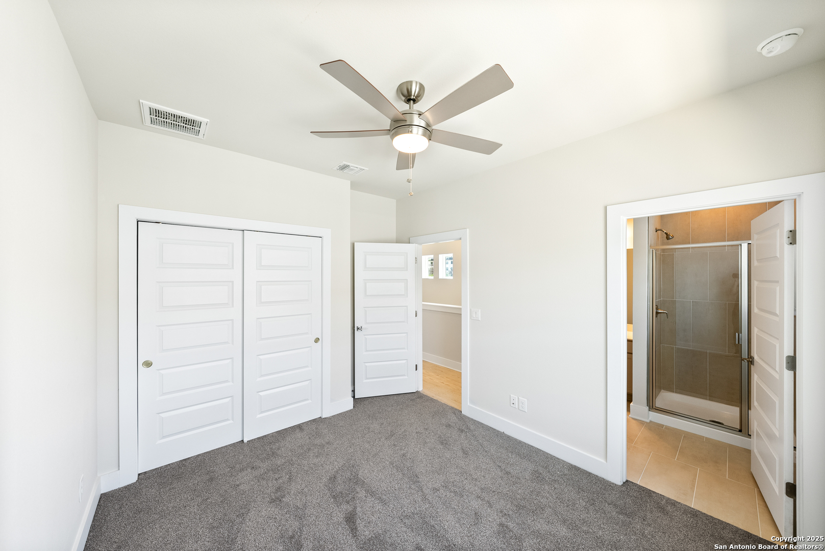 419 Ira Avenue, Unit 1101 San Antonio, TX 78209 - Photo 14 of 22 a view of a livingroom with a ceiling fan & a ceiling fan