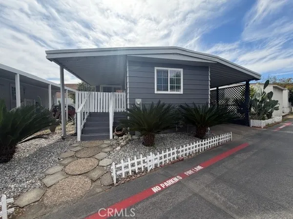 a view of backyard with plants and outdoor seating