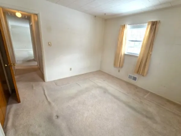 an empty room with windows