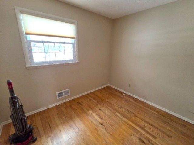 2908 Jamison Boulevard Mount Vernon, IL 62864 - Photo 33 of 40 a view of a room with wooden floor and a window