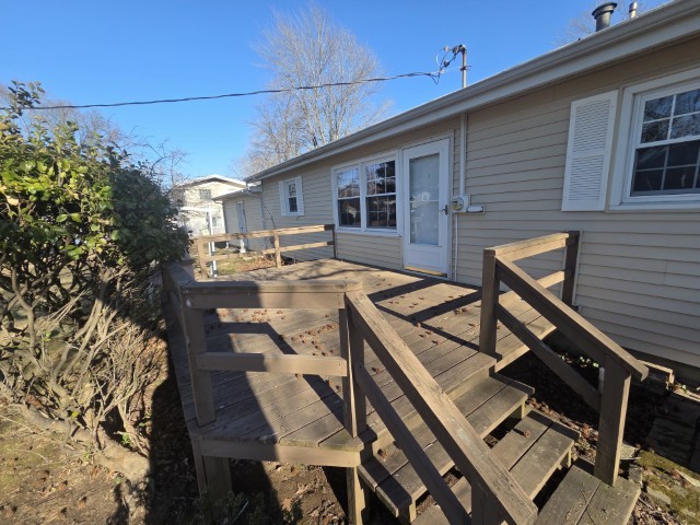 2908 Jamison Boulevard Mount Vernon, IL 62864 - Photo 10 of 40 a view of a patio with table and chairs with wooden floor and fence