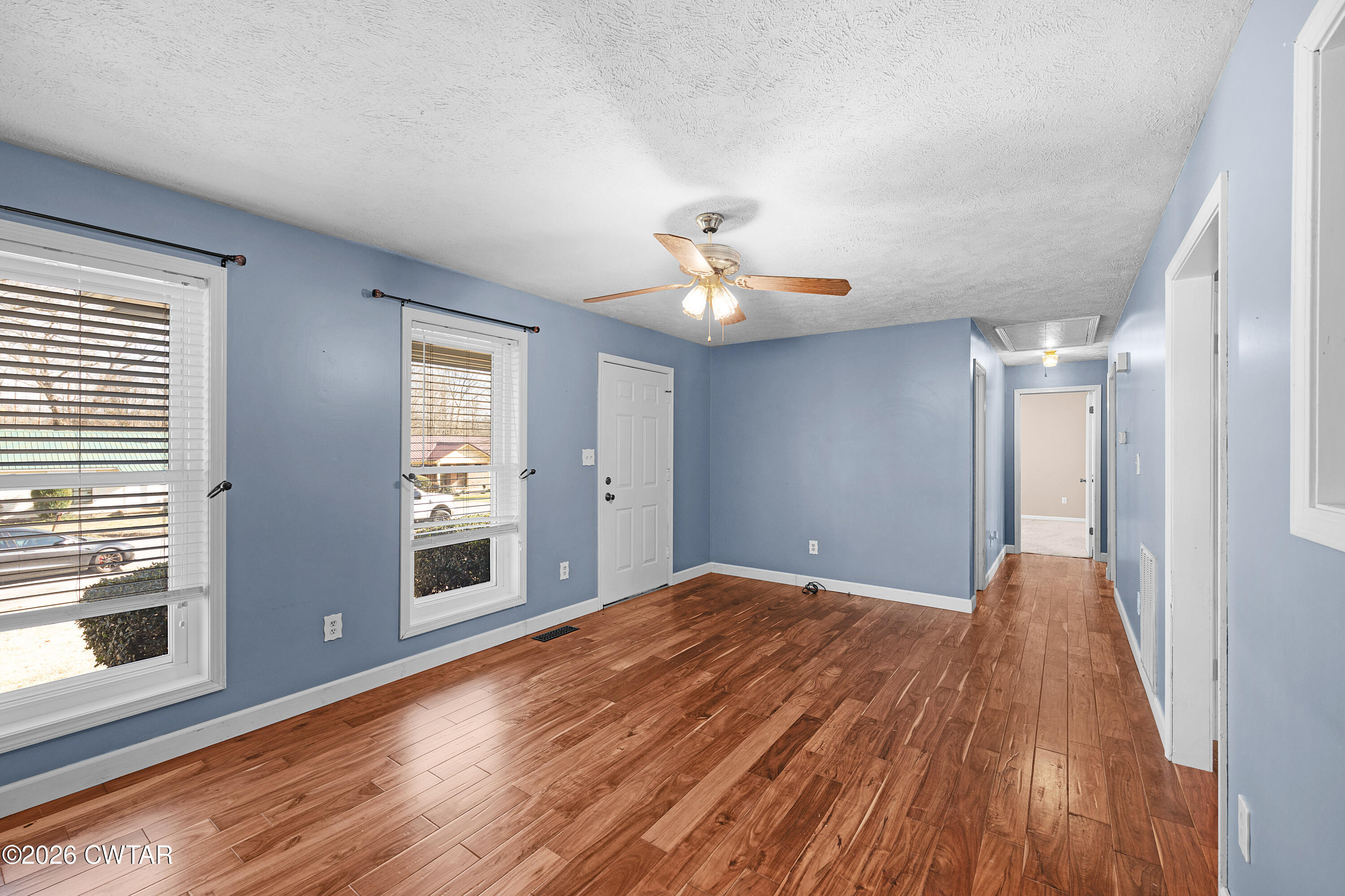 47 Roxy Cove Jackson, TN 38301 - Photo 12 of 18 a view of a livingroom with a ceiling fan and window