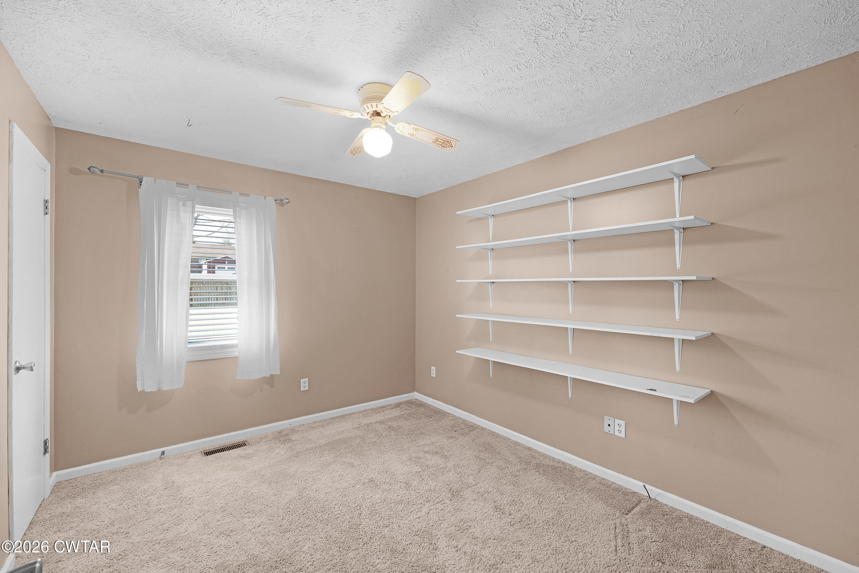 47 Roxy Cove Jackson, TN 38301 - Photo 14 of 18 a view of an empty room with a window