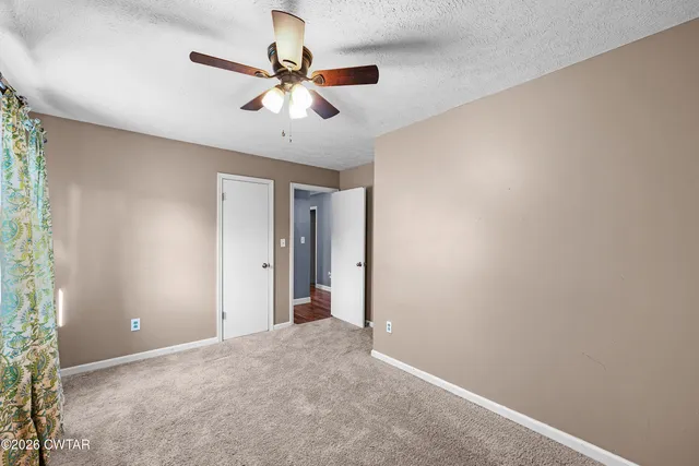 a bathroom with a sink mirror and toilet