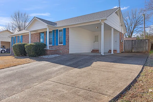 a view of a house with a street