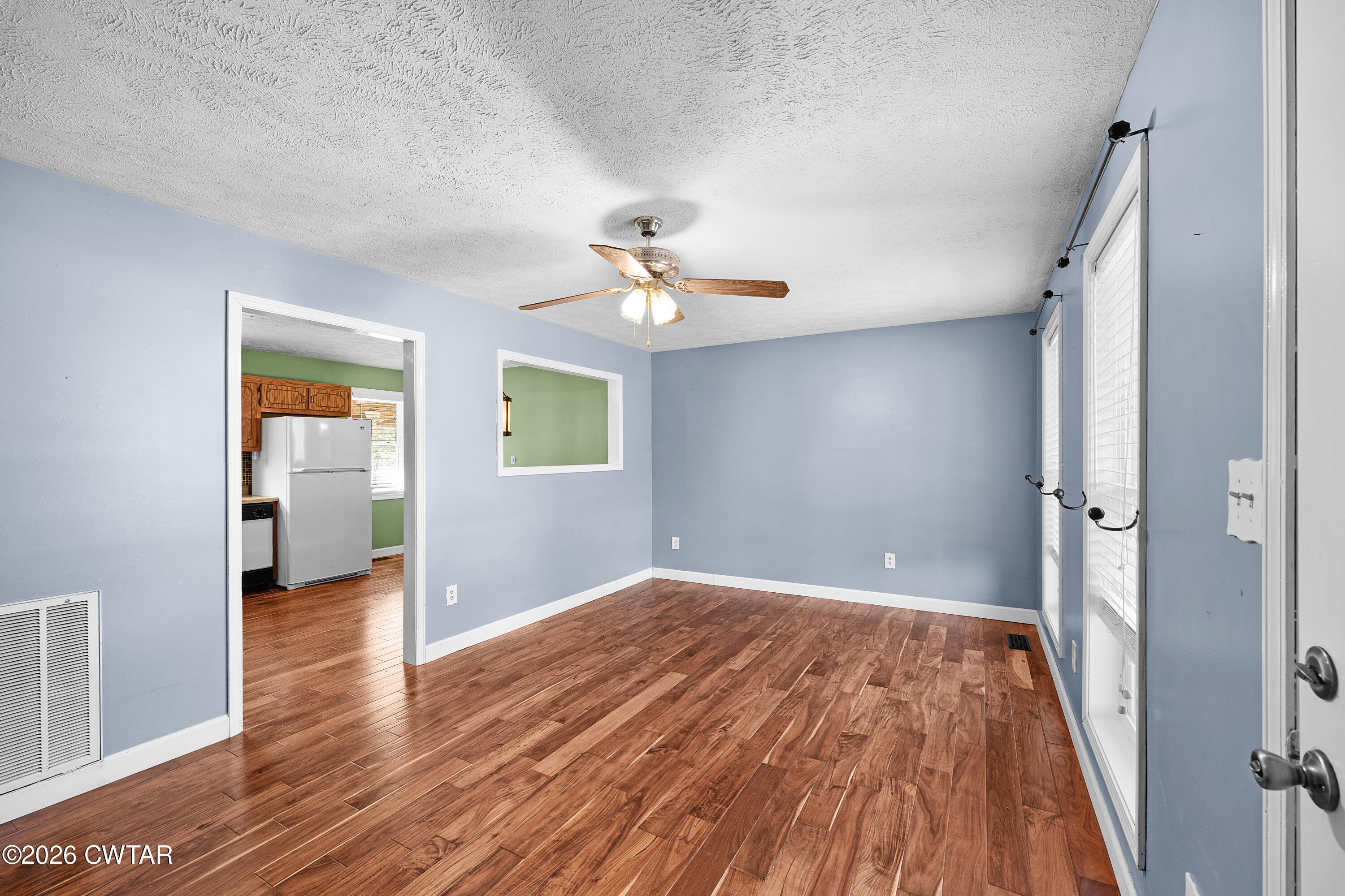 47 Roxy Cove Jackson, TN 38301 - Photo 10 of 18 wooden floor in an empty room with a window