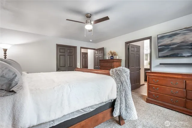 a bed room with a bed and a chair