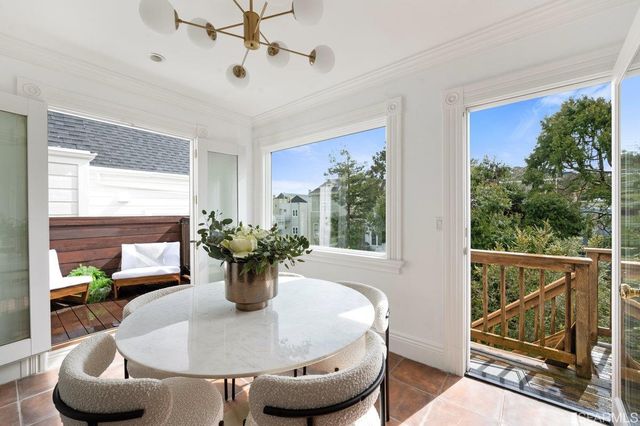 a dining room with furniture and window