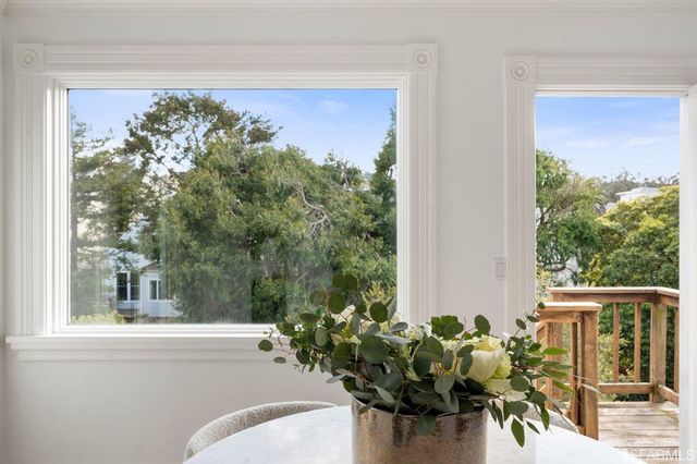 a view of a balcony with furniture