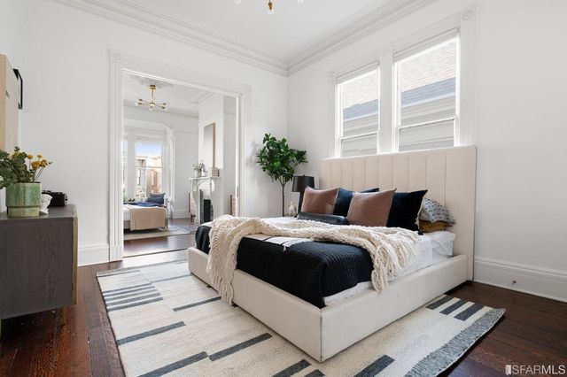 a living room with a bed and a couch