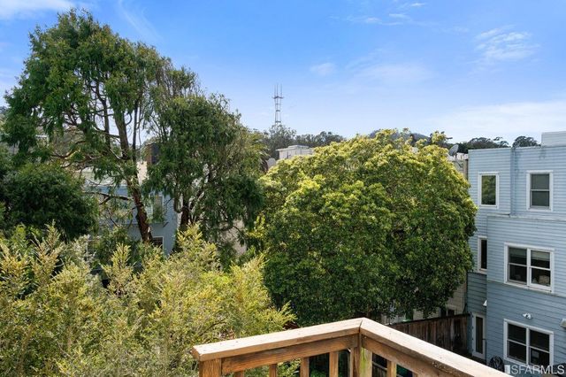 a view of a house with a tree