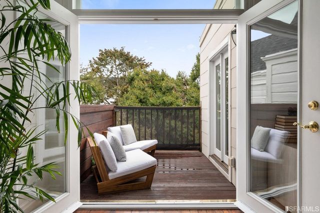 a view of balcony with furniture