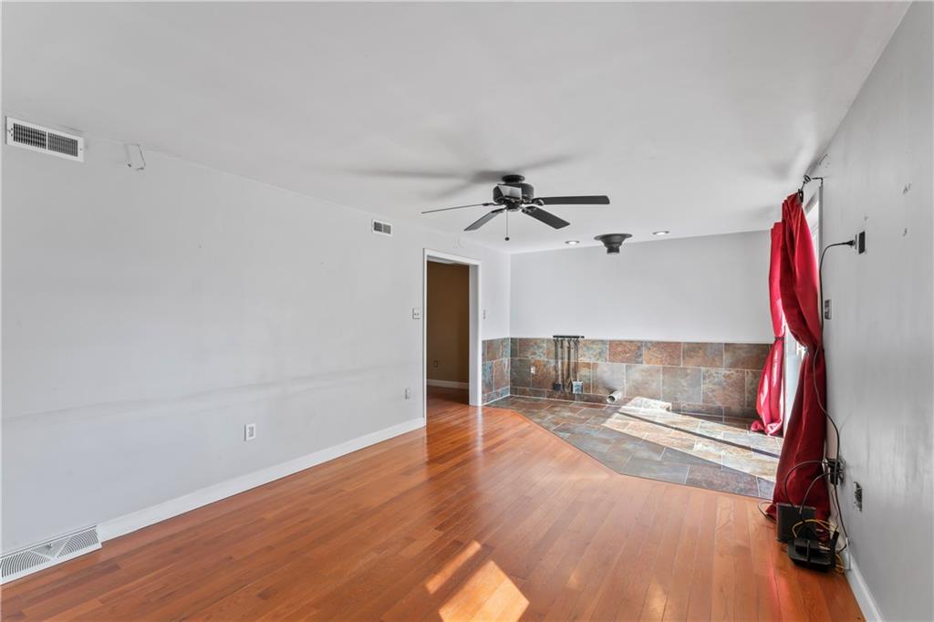 615 Midway Drive Beaver, PA 15009 - Photo 11 of 30 a view of a room with wooden floor fan and windows