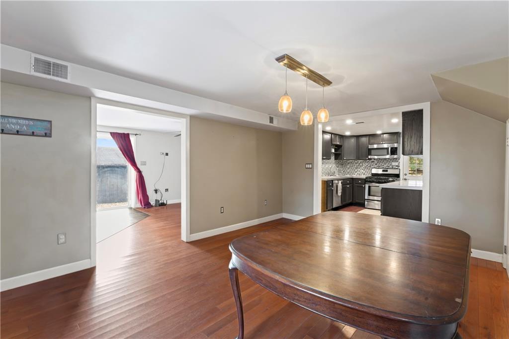 615 Midway Drive Beaver, PA 15009 - Photo 12 of 30 a kitchen with kitchen island white cabinets and stainless steel appliances
