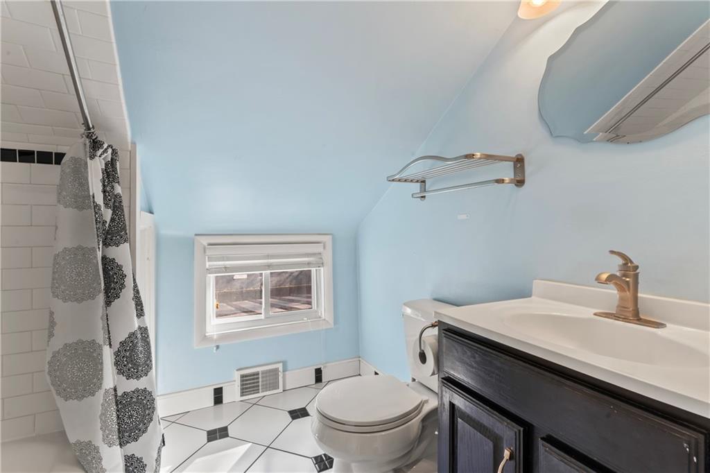 615 Midway Drive Beaver, PA 15009 - Photo 24 of 30 a bathroom with a sink toilet and a mirror