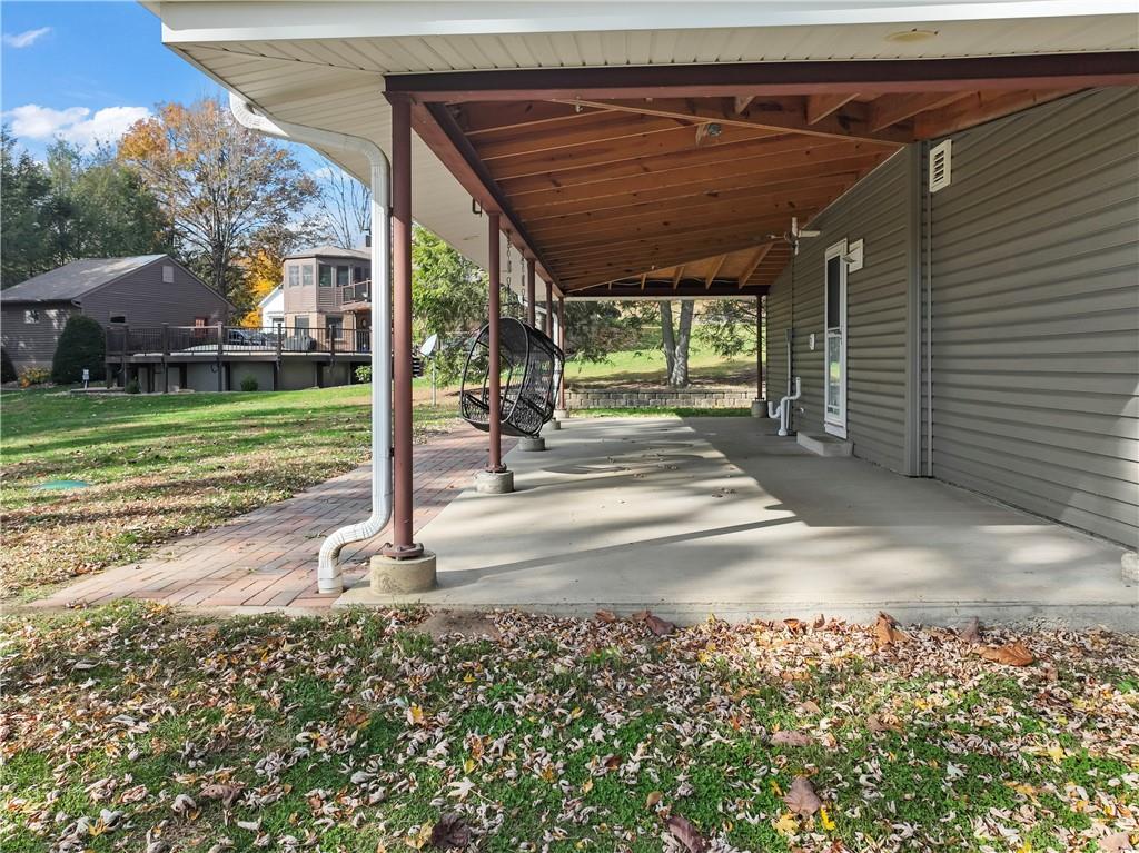 615 Midway Drive Beaver, PA 15009 - Photo 4 of 30 a view of a porch with a table chairs and a backyard