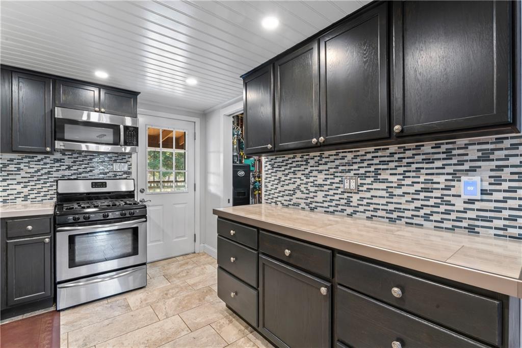 615 Midway Drive Beaver, PA 15009 - Photo 8 of 30 a kitchen with sink cabinets and stainless steel appliances
