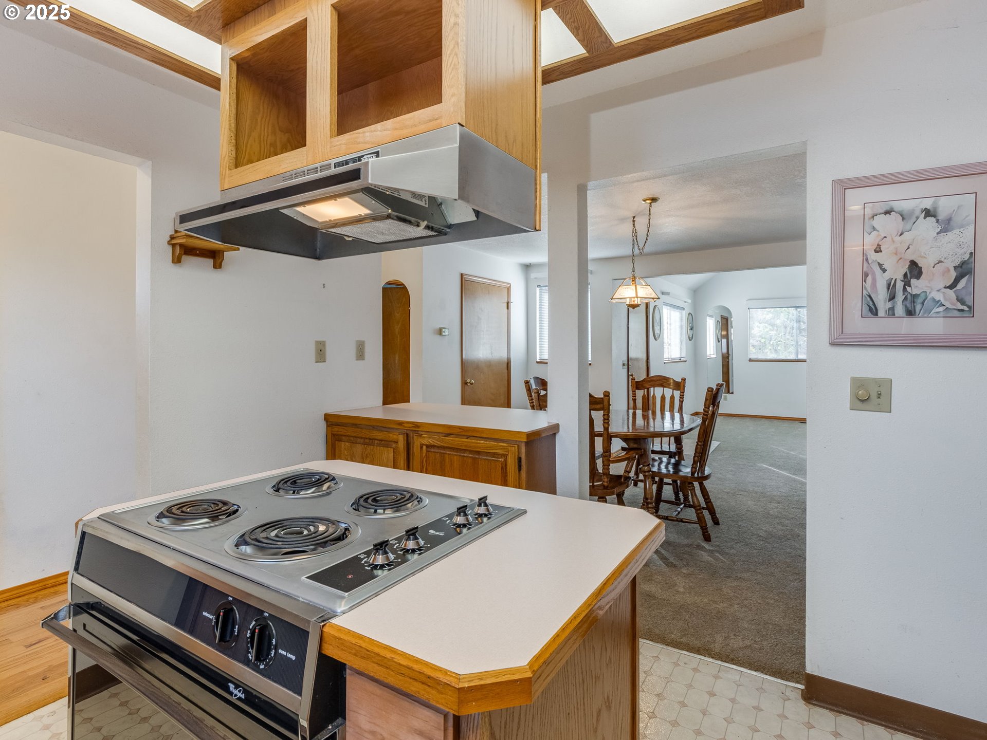458 West Hayes Street Woodburn, OR 97071 - Photo 11 of 22 a kitchen with a stove and a table