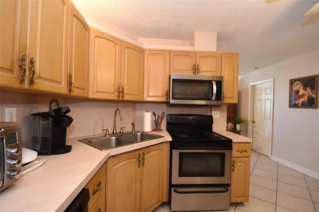 a kitchen with a stove and a microwave