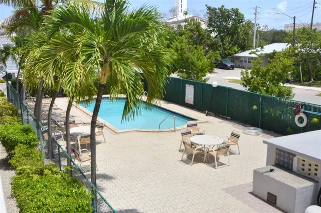a view of swimming pool with seating space