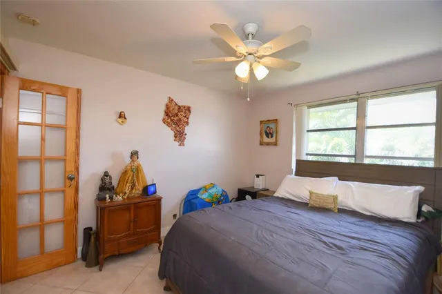 a bed room with a bed and a window