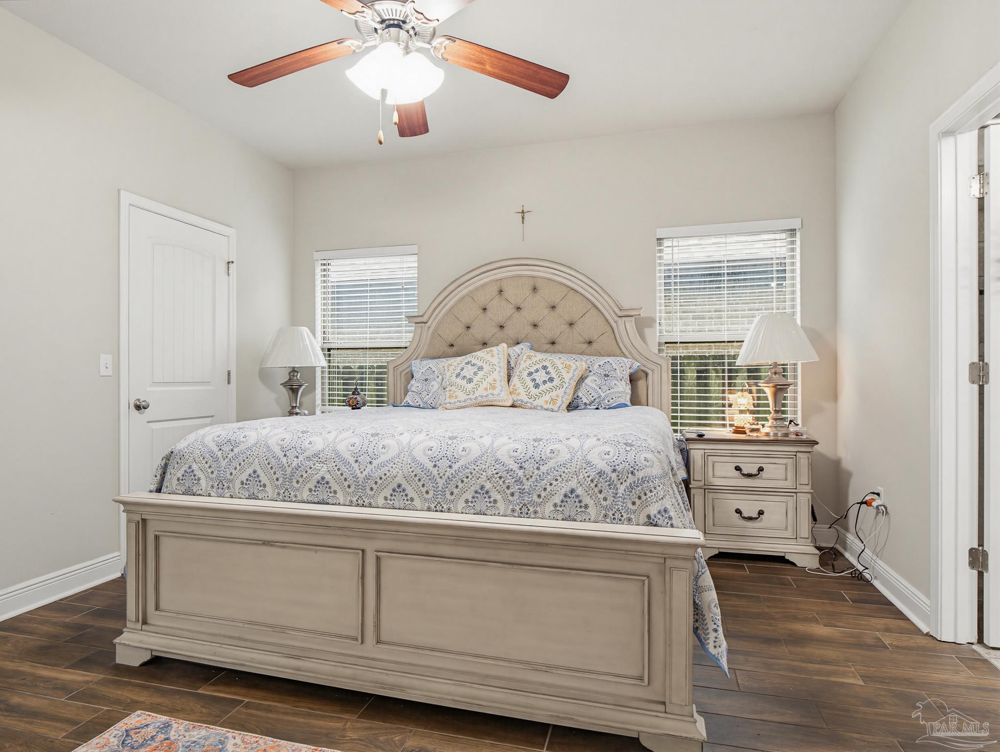6294 Ladera Trail Pace, FL 32571 - Photo 18 of 50 a bedroom with a bed and a chandelier