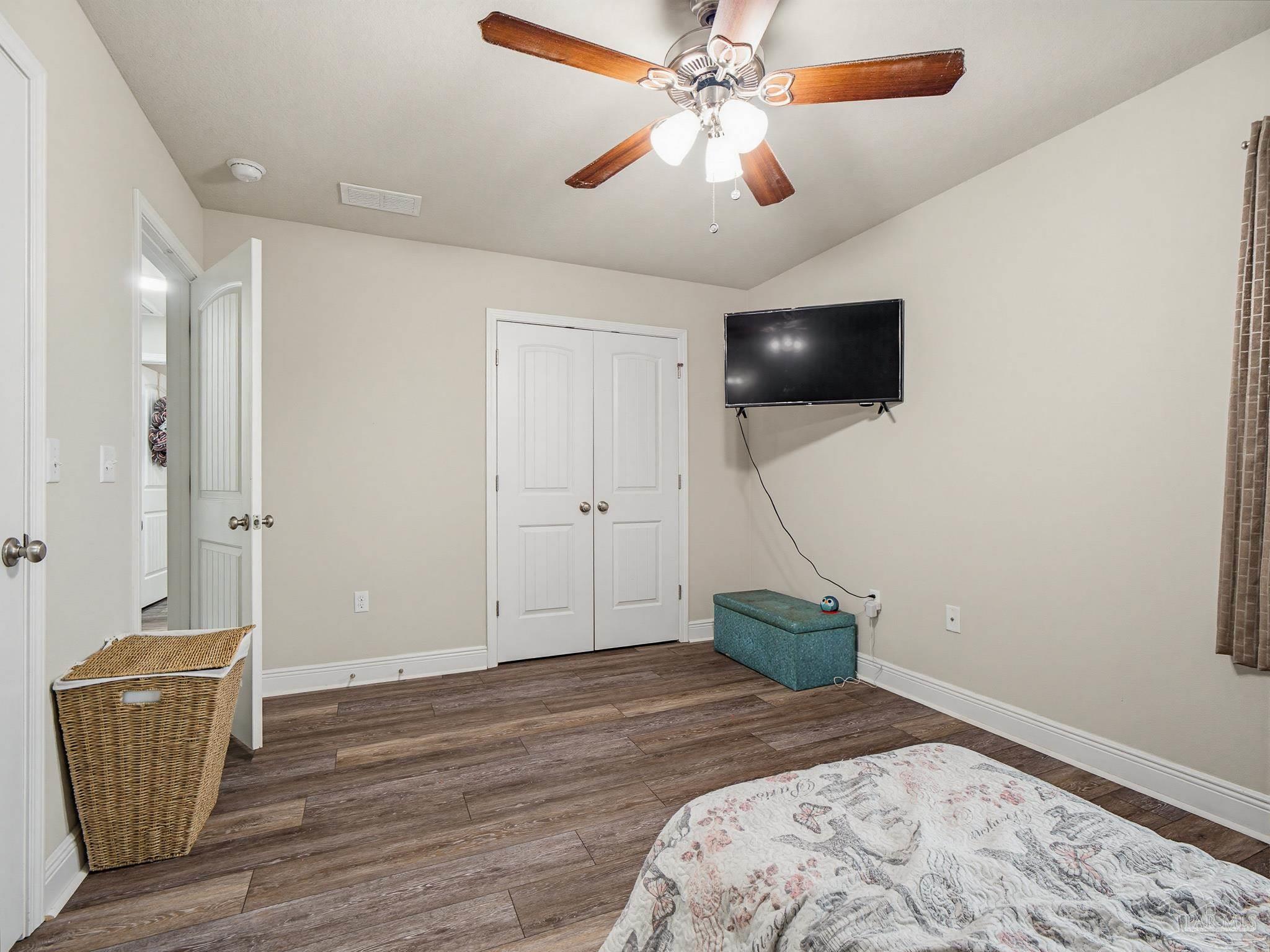 6294 Ladera Trail Pace, FL 32571 - Photo 39 of 50 a bedroom with a bed and a television