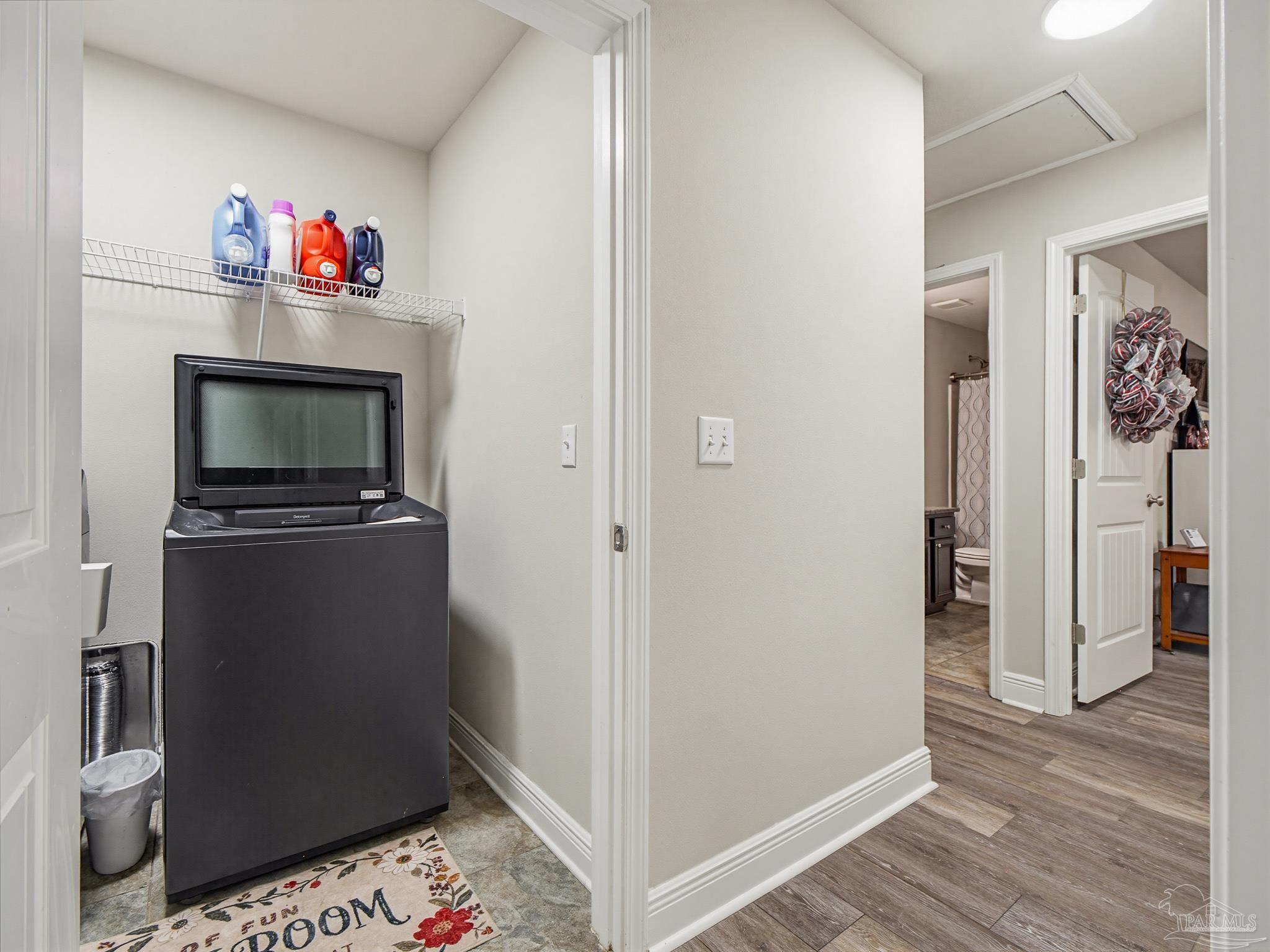 6294 Ladera Trail Pace, FL 32571 - Photo 40 of 50 a living room with a bed and a television