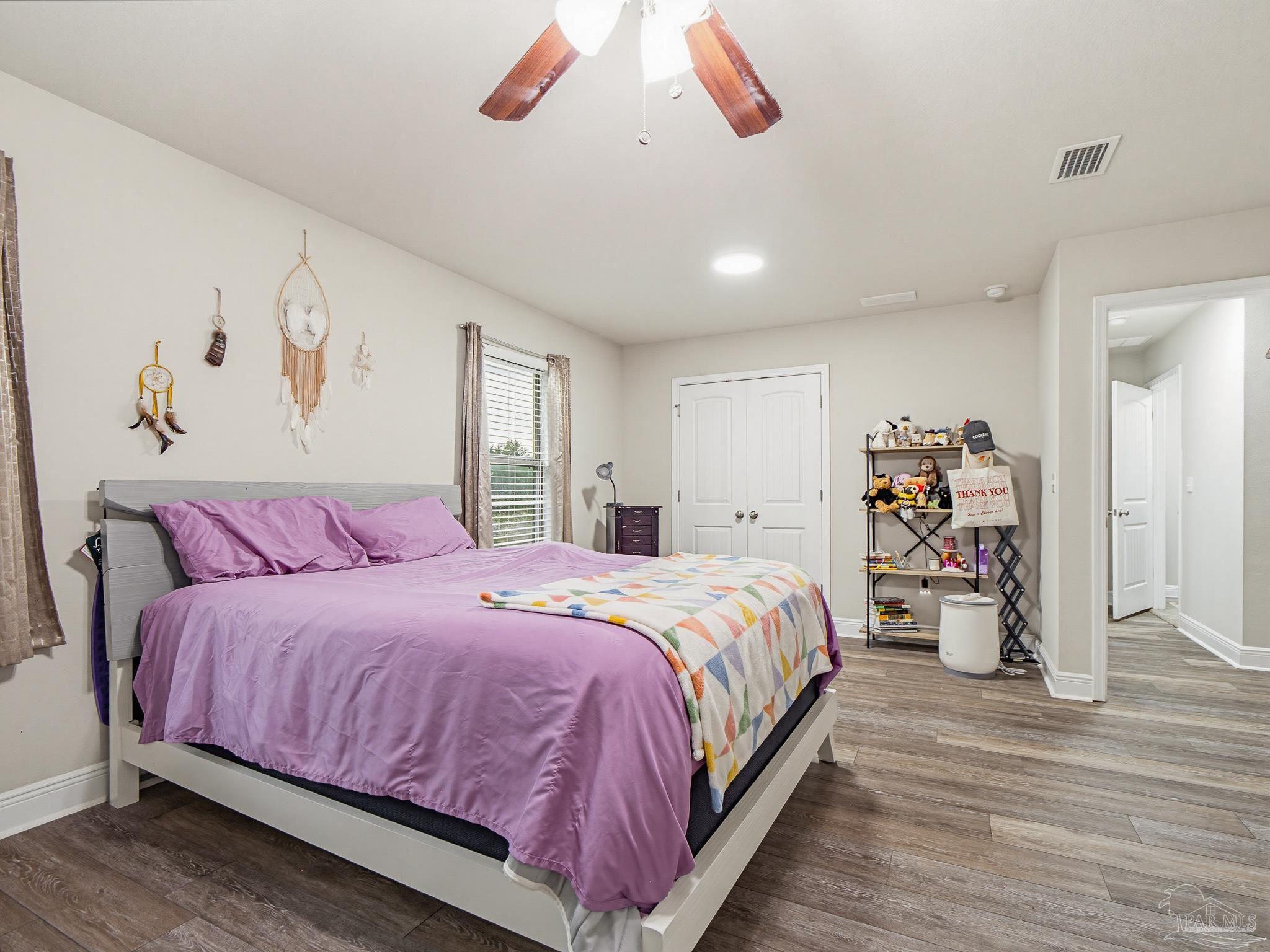 6294 Ladera Trail Pace, FL 32571 - Photo 46 of 50 a bedroom with a large bed and a large window
