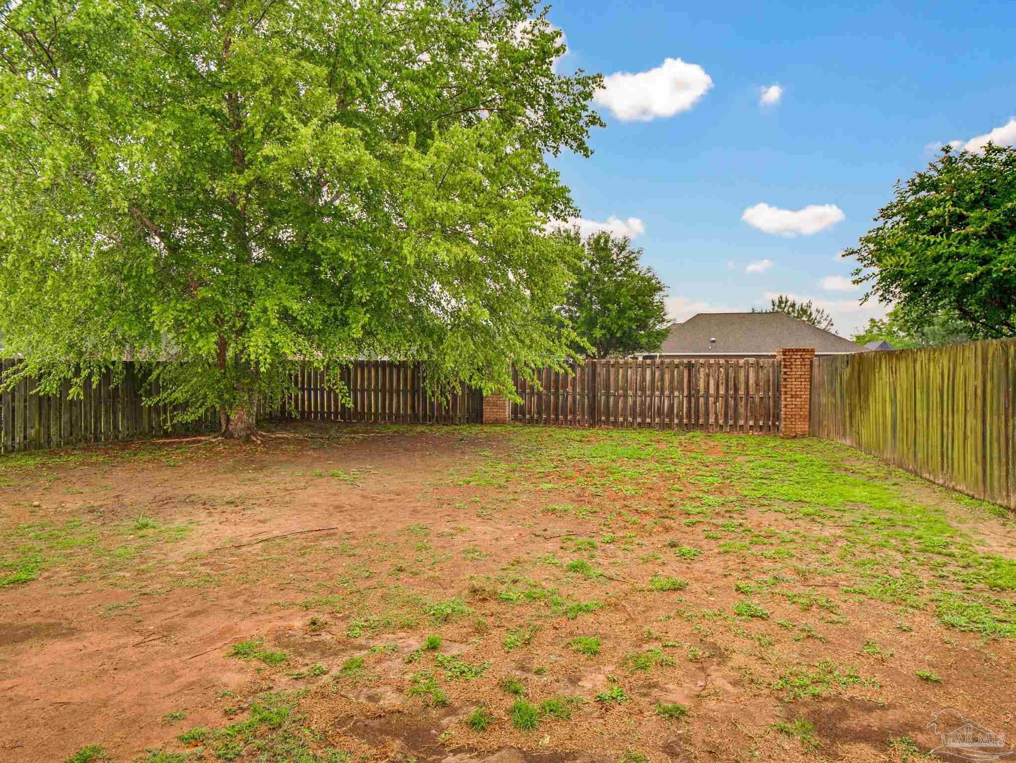 6294 Ladera Trail Pace, FL 32571 - Photo 50 of 50 a backyard of a house with lots of green space