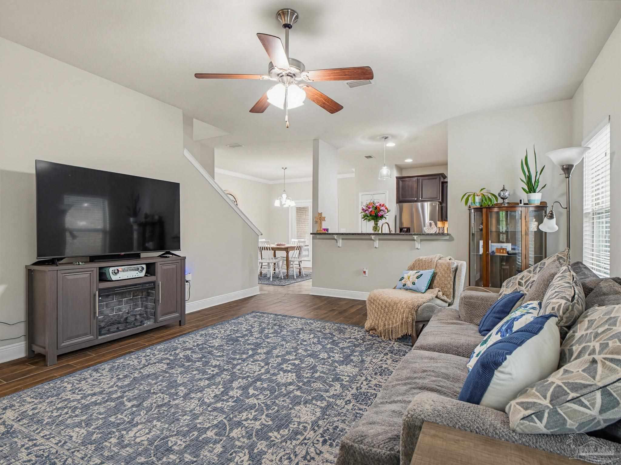6294 Ladera Trail Pace, FL 32571 - Photo 5 of 50 a living room with furniture and a flat screen tv