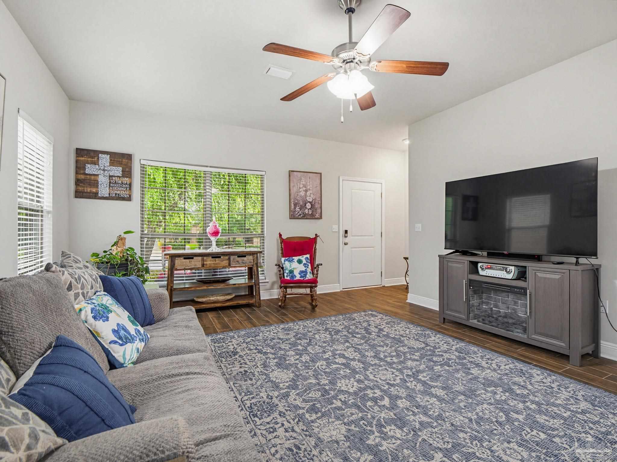 6294 Ladera Trail Pace, FL 32571 - Photo 6 of 50 a living room with furniture and a flat screen tv