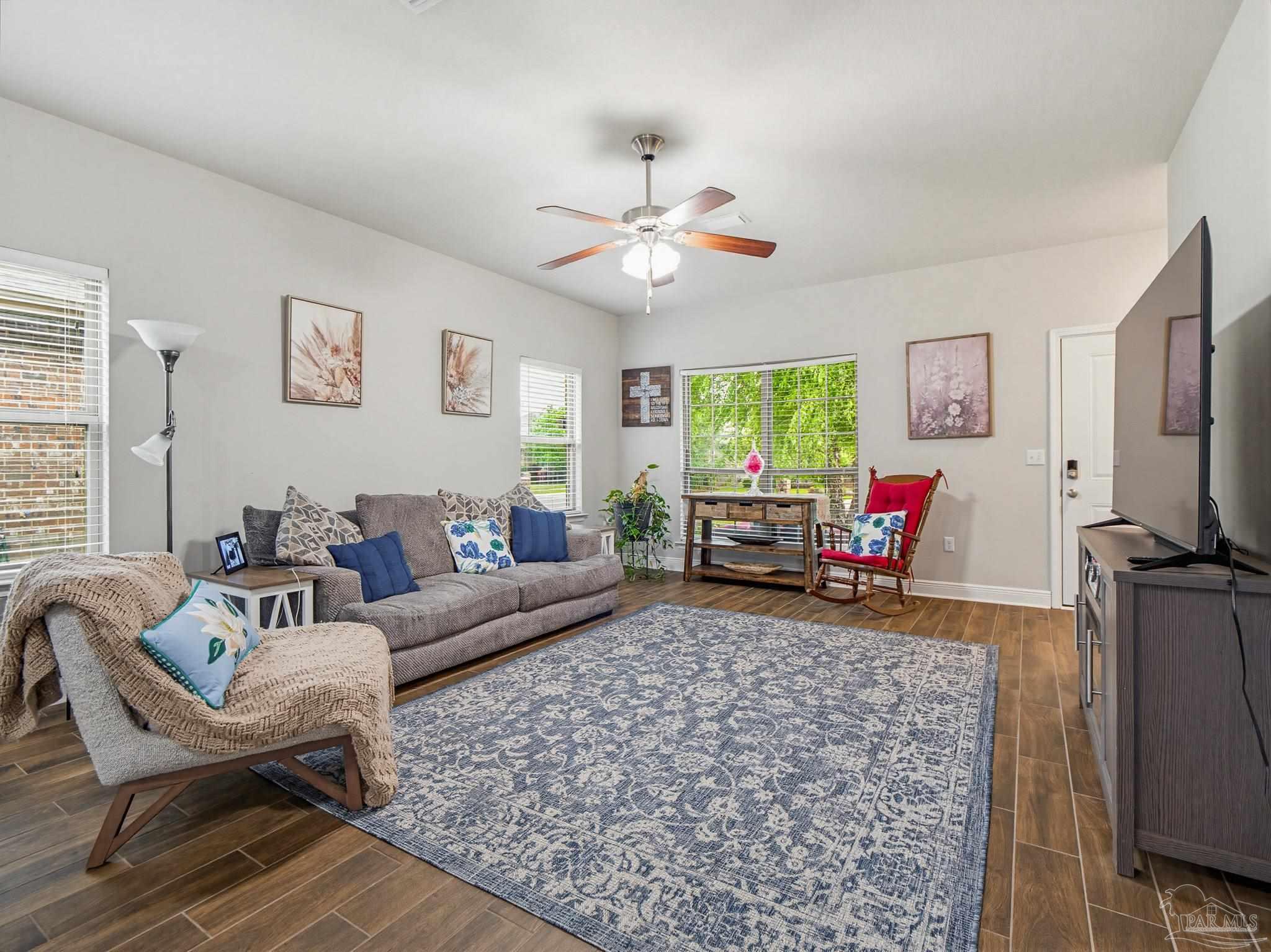 6294 Ladera Trail Pace, FL 32571 - Photo 7 of 50 a living room with furniture and a flat screen tv