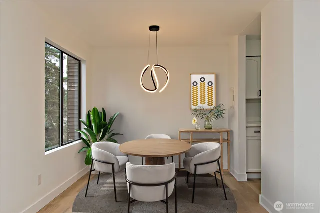 a dining room with furniture and window