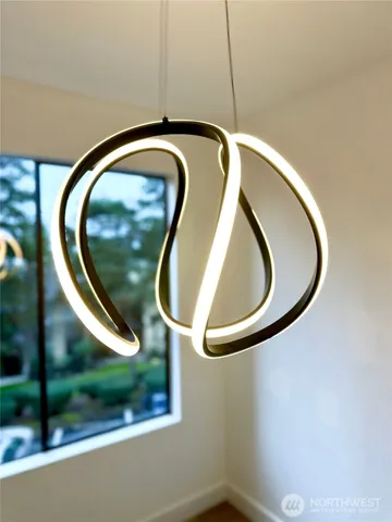 a kitchen with stainless steel appliances granite countertop a sink cabinets and wooden floor