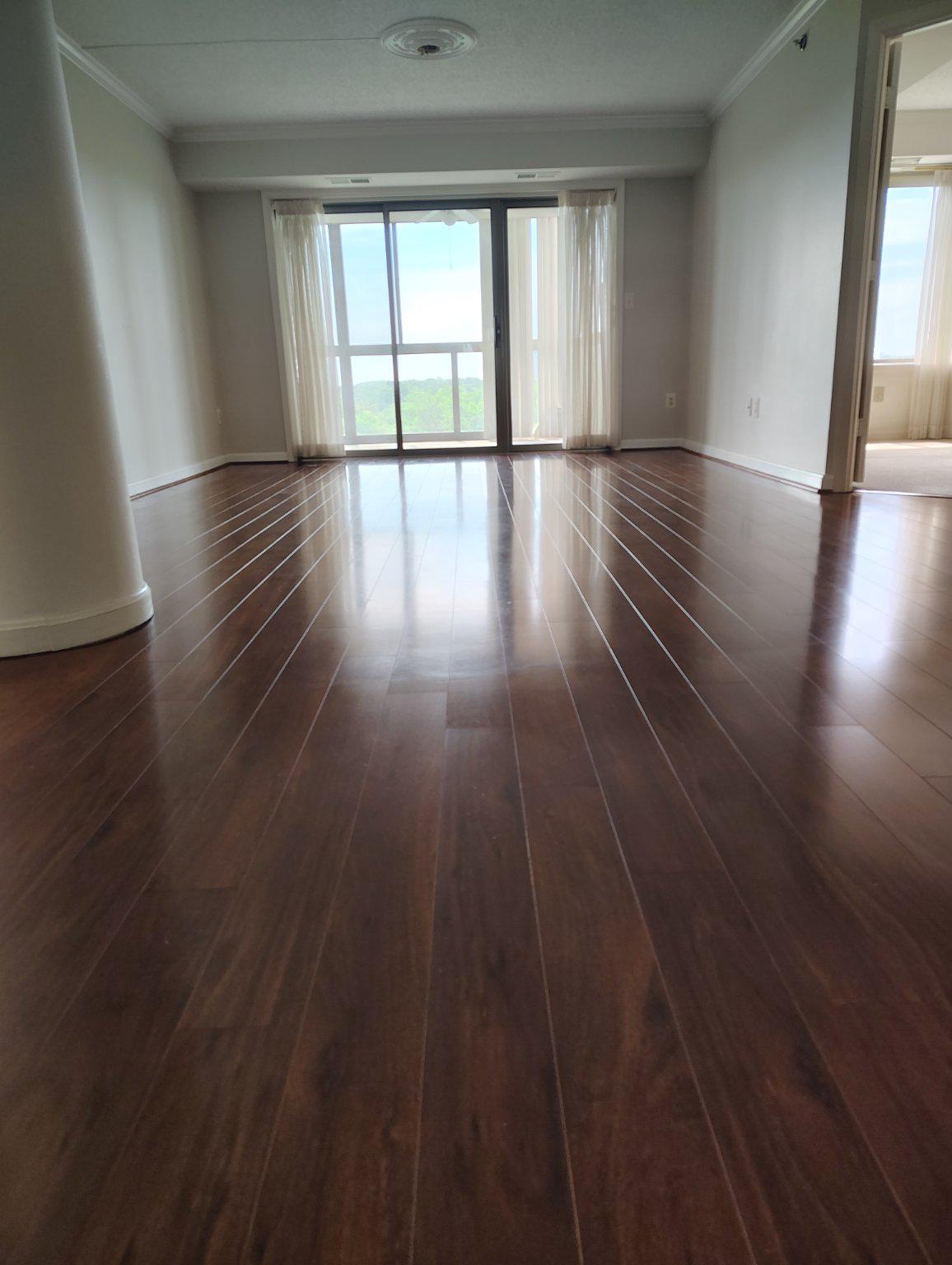 19385 Cypress Ridge Terrace, Unit 920 Leesburg, VA 20176 - Photo 7 of 40 Living Room with cherry laminate floors.