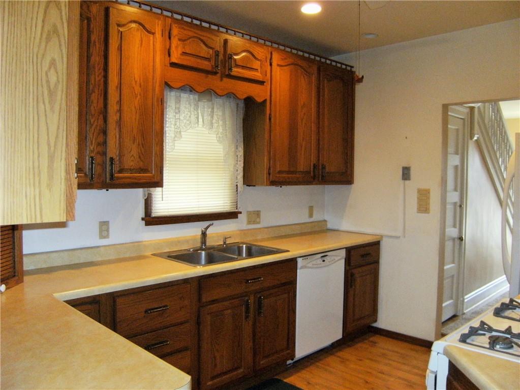 2733 Middletown Road Pittsburgh, PA 15205 - Photo 8 of 25 Kitchen With New Laminate Flooring And Updated Cabinets And Appliances
