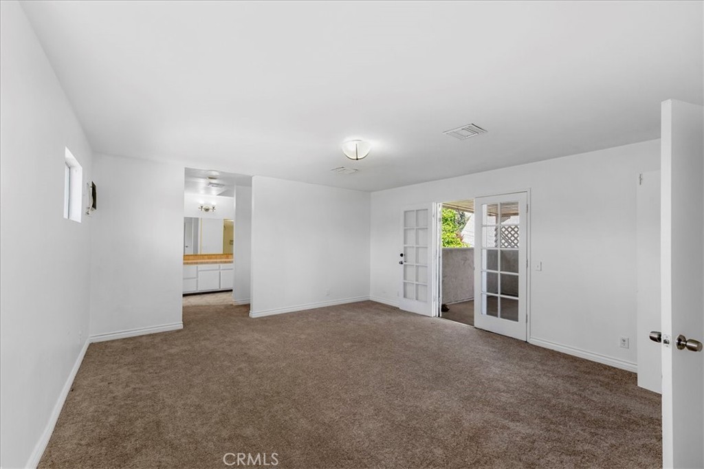 1128 South Parton Street Santa Ana, CA 92707 - Photo 18 of 32 an empty room with windows and closet