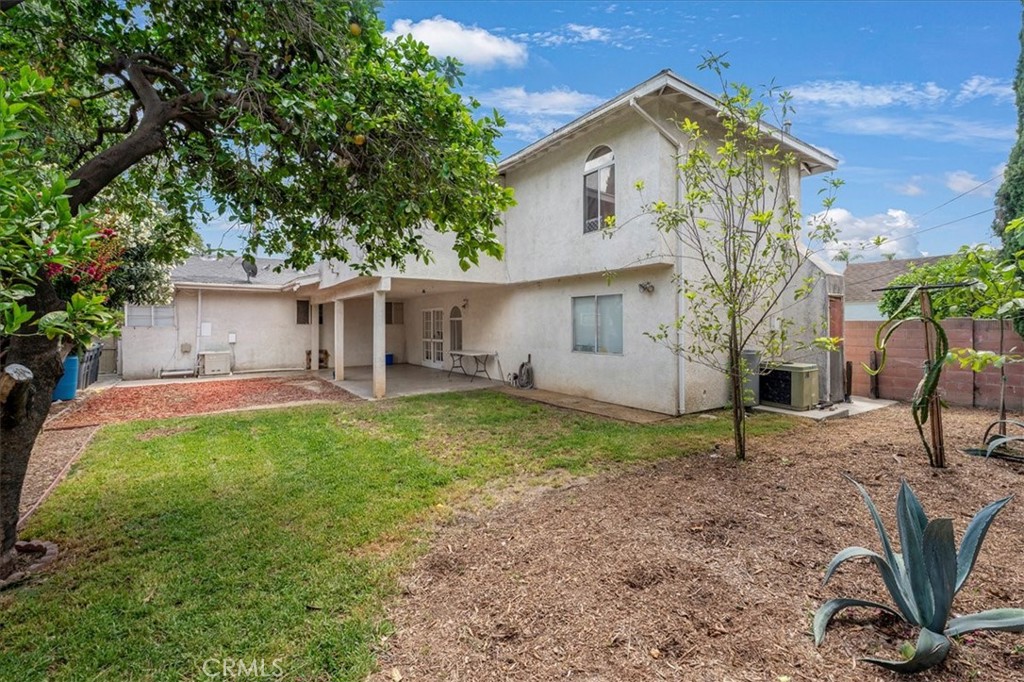 1128 South Parton Street Santa Ana, CA 92707 - Photo 25 of 32 a view of a house with backyard and garden
