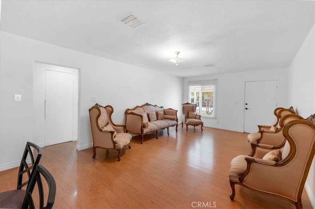 1128 South Parton Street Santa Ana, CA 92707 - Photo 4 of 32 a living room with furniture and gym equipment