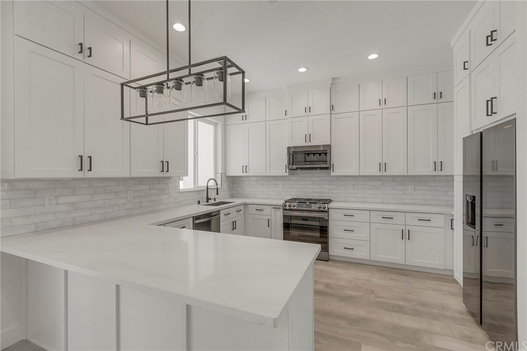 1830 Apple View Way Paradise, CA 95969 - Photo 19 of 75 a kitchen with stainless steel appliances granite countertop a sink stove and refrigerator