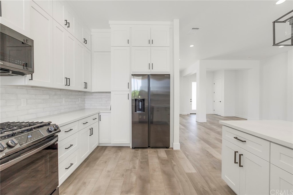 1830 Apple View Way Paradise, CA 95969 - Photo 23 of 75 a kitchen with stainless steel appliances granite countertop a refrigerator and a stove top oven