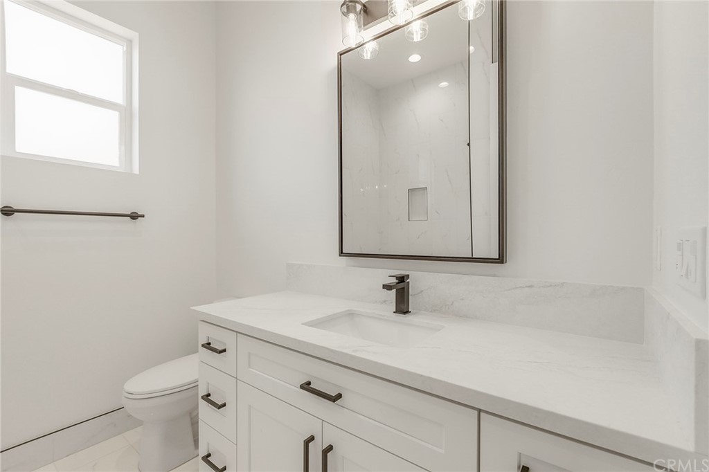 1830 Apple View Way Paradise, CA 95969 - Photo 45 of 75 a bathroom with a sink a toilet and mirror