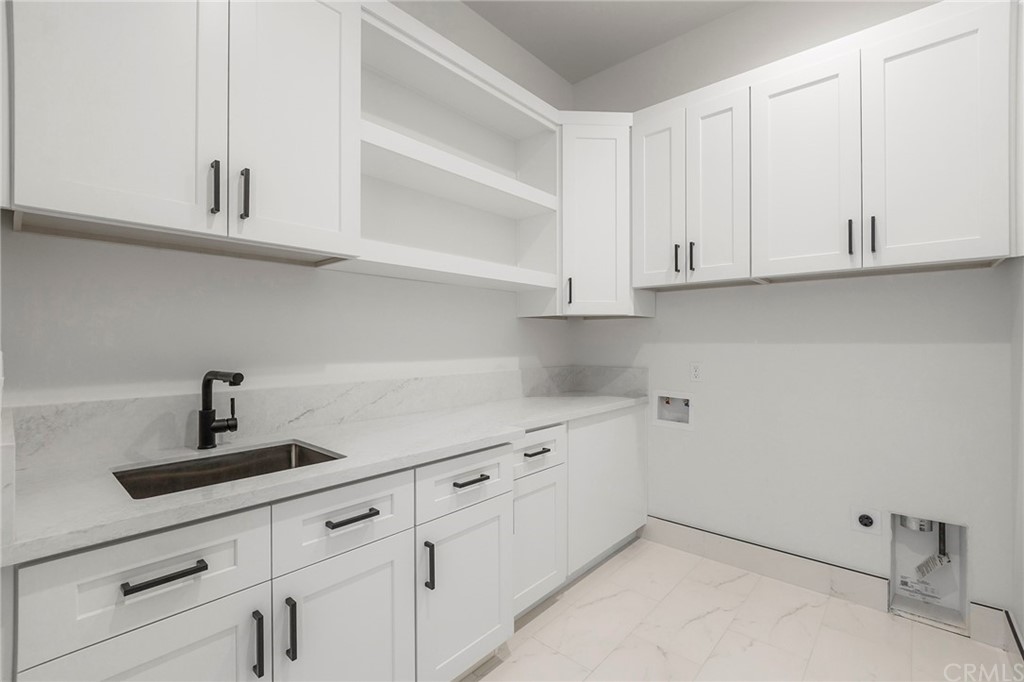 1830 Apple View Way Paradise, CA 95969 - Photo 47 of 75 a kitchen with white cabinets and a sink